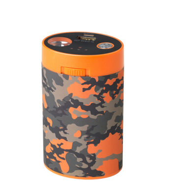 Camouflage-patterned cylindrical battery pack with orange details and charging plug. Use with heated clothing in outdoor activities.