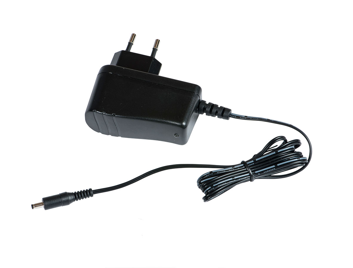 A black power supply with a cord and European plug stopper, probably for charging electrical appliances.