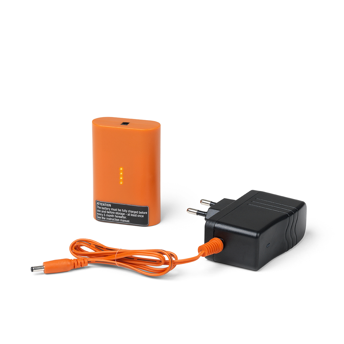 Orange battery with charger connected to an orange wire, presented against a white background. Text: "ATTENTION: This battery must be fully charged before use... see the instruction manual."