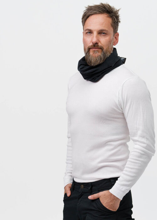 A person wearing a white sweater and a black neck warmer from NordicHeat suggests warmth and comfort. The design supports an active lifestyle in a cool environment. No text is visible.