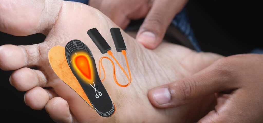 Foot with NordicHeat warming insole adjusts for a perfect fit. Trademarks and symbols illustrate product use for active lifestyle. Two black batteries connected by orange cord.